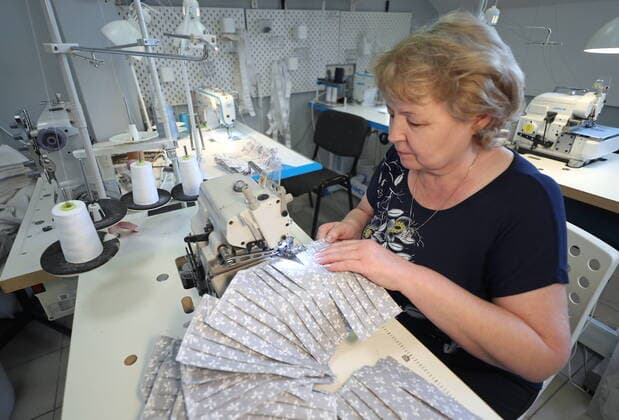 KAZAN, RUSSIA - MARCH 23, 2020: Making reusable face masks at the Chudo Mamy Wonder Moms sewing shop employing mothers of large families and mothers of children with challenges. Yegor Aleyev TASS  TS0D3241