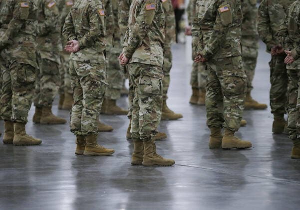 Members of the National Guard are on site at the Jacob Javits Convention Center before Gov. Andrew Cuomo speaks with the National Guard on site in New York City on Monday, March 23, 2020. The Javits Center is setting up to be turned into field hospitals to test and possibly treat cases of COVID-19 infections. New York state now accounts for about 1 percent of the coronavirus-related deaths in the world and New York City has more than 12,300 of those cases.  NYP20200323120 JOHNxANGELILLO