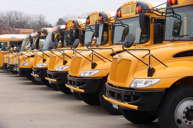 Buses sit idle as school resumes after spring break, in the Parkway School District, in Chesterfield, Missouri on Monday, March 23, 2020. Students are in classes but is being done by computer due to Coronavirus fears.  SLP2020032304 BILLxGREENBLATT