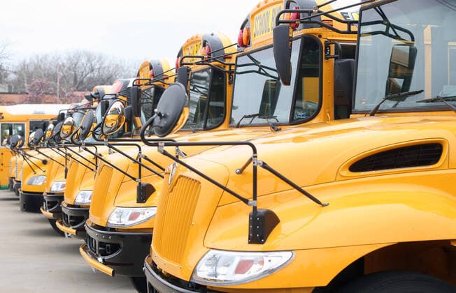 Buses sit idle as school resumes after spring break, in the Parkway School District, in Chesterfield, Missouri on Monday, March 23, 2020. Students are in classes but is being done by computer due to Coronavirus fears.  SLP2020032305 BILLxGREENBLATT