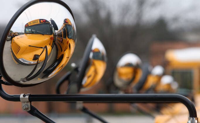 Buses sit idle as school resumes after spring break, in the Parkway School District, in Chesterfield, Missouri on Monday, March 23, 2020. Students are in classes but is being done by computer due to Coronavirus fears.  SLP2020032308 BILLxGREENBLATT