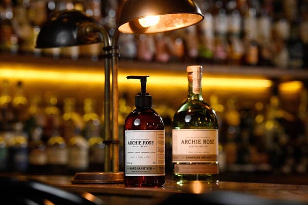 ARCHIE ROSE HAND SANITISER, A bottle of the new Archie Rose Distilling gin-infused hand sanitiser (left) is seen in Sydney, Tuesday, March 24, 2020. Using leftover botanicals from their gin, the idea to produce the hand sanitiser came from trying to keep their bar staff employed during the COVID-19 shut down of license venues. The hand sanitiser has so far sold out online, but will be sold to the general public and wholesalers. ( NO ARCHIVING, EDITORIAL USE ONLY, NO USE IN BOOKS WITHOUT CONSENT SYDNEY NSW AUSTRALIA  Copyright: xBIANCAxDExMARCHIx 20200324001459062384