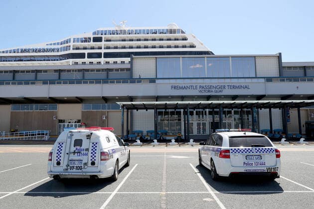 MSC MAGNIFICA PERTH, Police vehicles are seen parked outside the Fremantle Passenger Teminal where the MSC Magnifica cruise ship is docked in Fremantle harbour in Fremantle on Tuesday March 24, 2020. This ship will refuel before departing for Dubai at 6pm. WA has 140 cases of COVID-19, including two people who are in a critical condition. ( NO ARCHIVING, EDITORIAL USE ONLY, NO USE IN BOOKS WITHOUT CONSENT PERTH WA AUSTRALIA  Copyright: xRICHARDxWAINWRIGHTx 20200324001459066061