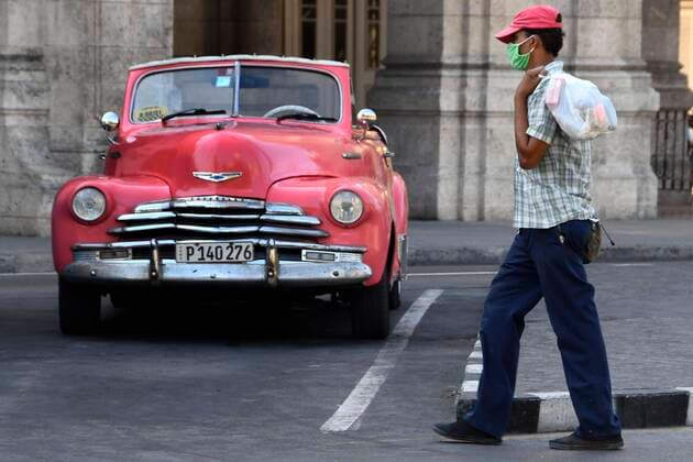(200324) -- HAVANA, March 24, 2020 (Xinhua) -- A man wearing a mask is seen on a street in Havana, Cuba, March 23, 2020. Cuban President Miguel Diaz Canel on Monday urged state institutions, private sectors and people to increase control and discipline in an effort to contain the COVID-19 outbreak. (Photo by Joaquin Hernandez Xinhua) CUBA-HAVANA-COVID-19 