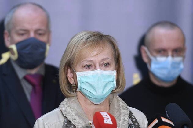 Doctor Hana Rohacova, center, with a protection face mask attends a press conference on assessment of development of COVID-19 illness, on March 24, 2020, in Prague, Czech Republic. (CTKxPhoto OndrejxDeml) CTKPhotoP202003240220601 _DML8764