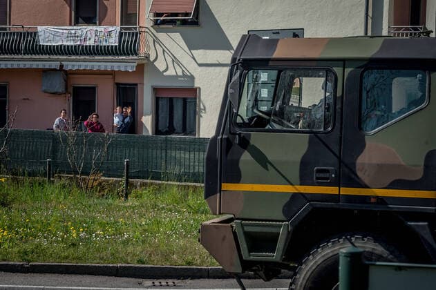 Ponte San Pietro. (Bergamo) Military and medical personnel of the Army together with the Carabinieri transport the coffins with the use of six trucks from a warehouse in Ponte San Pietro due to emergency COVID19 Coronavirus In the photo some inhabitants greet the coffins while leaving the country with the use of Army trucks (Carlo Cozzoli Fotogramma, San Pietro bridge - 2020-03-24) p.s. la foto e utilizzabile nel rispetto del contesto in cui e stata scattata, e senza intento diffamatorio del decoro delle persone rappresentate  Copyright: xCarloxCozzolix xFOTOGRAMMAx