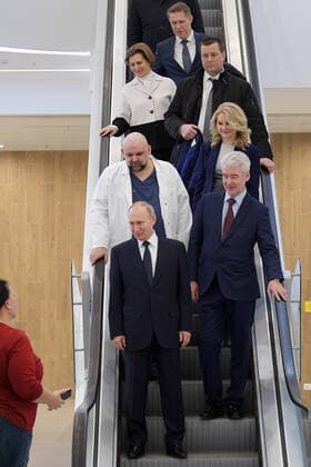 MOSCOW, RUSSIA - MARCH 24, 2020: Russia s President Vladimir Putin and Moscow Mayor Sergei Sobyanin (L-R front) followed by chief physician Denis Protsenko, Russia s Deputy Prime Minister Tatyana Golikova (L-R 2nd row), Chief State Sanitary Physician Anna Popova (L 3rd row) and Healthcare Minister Mikhail Murashko (back) on their visit to the Novomoskovsky multipurpose medical center for patients suspected of the COVID-19 coronavirus infection. Alexei Druzhinin Russian Presidential Press and Information Office TASS  TS0D337F