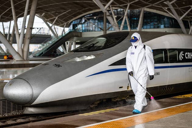 (200324) -- WUHAN, March 24, 2020 -- A firefighter conducts disinfection on the platform of Wuhan Railway Station in Wuhan, central China s Hubei Province, March 24, 2020. Over 70 firefighters conducted a comprehensive disinfection at the railway station on Tuesday. (Photo by Xinhua) CHINA-HUBEI-WUHAN-RAILWAY STATION-DISINFECTION (CN) HexHanqiu 