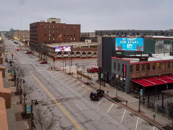 March 24, 2020, Des Moines, Iowa, U.S: A public service announcement about the coronavirus on an electronic billboard in the historic district of downtown Des Moines. Des Moines was virtually deserted Tuesday as many people chose to stay in their homes. On Tuesday morning, 24 March, Iowa reported over 120 confirmed cases of the Coronavirus (SARS-CoV-2) and COVID-19. Restaurants, bars, movie theaters, places that draw crowds are closed for at least 30 days. The Governor has not ordered shelter in place but several Mayors, including the Mayor of Des Moines, have asked residents to stay in their homes for all but the essential needs. People are being encouraged to practice social distancing and many businesses are requiring or encouraging employees to telecommute. Des Moines U.S. - ZUMAk94_ 20200324_zaf_k94_007 Copyright: xJackxKurtzx