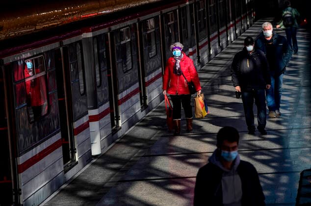 People wear face masks in the Rajska zahrada underground station in Prague, Czech Republic, March 24, 2020. (CTKxPhoto RomanxVondrous) CTKPhotoP202003241000401 vnd 2