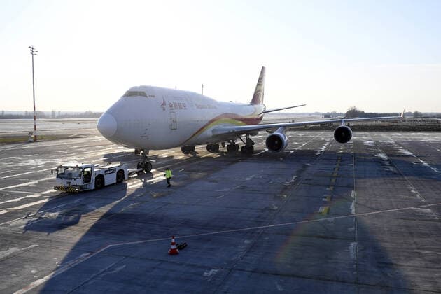 (200324) -- BUDAPEST, March 24, 2020 (Xinhua) -- Photo taken on March 24, 2020 shows a charter airplane carrying medical supplies from China upon its arrival at the Budapest Liszt Ferenc International Airport in Budapest, Hungary. A new shipment from China, carrying supplies purchased by the Hungarian government to battle the COVID-19, arrived at the airport on Tuesday. (Tamas Kovacs MTI Handout via Xinhua) HUNGARY-BUDAPEST-COVID-19-MEDICAL SUPPLIES FROM CHINA-ARRIVAL 