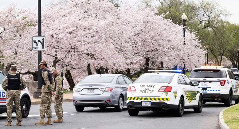 March 24, 2020, Washington, DC, United States: March 24, 2020 - Washington, DC, United States: The Washington DC Tidal Basin Cherry Blossom Trees. Starting Monday, March 23, the Metropolitan Police Department, supplemented by some members of Washington DC National Guard, set up a perimeter around the Tidal Basin to enfore social distancing by keeping people away from the trees so that people would not crowd there while looking at the trees, as they had in previous days. Washington United States - ZUMAb161 20200324_zap_b161_006 Copyright: xMichaelxBrochsteinx