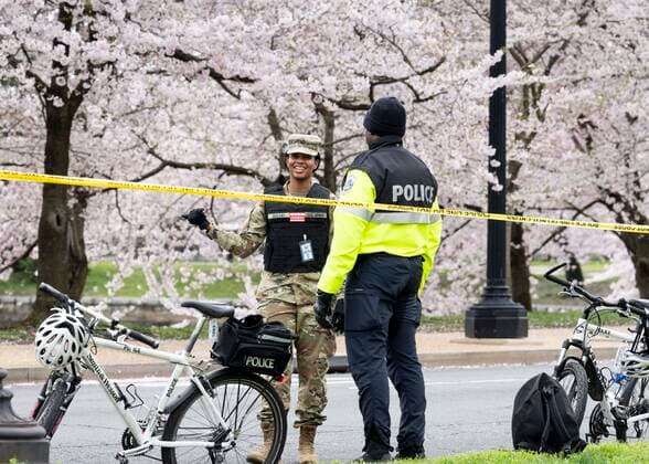 March 24, 2020, Washington, DC, United States: March 24, 2020 - Washington, DC, United States: The Washington DC Tidal Basin Cherry Blossom Trees. Starting Monday, March 23, the Metropolitan Police Department, supplemented by some members of Washington DC National Guard, set up a perimeter around the Tidal Basin to enfore social distancing by keeping people away from the trees so that people would not crowd there while looking at the trees, as they had in previous days. Washington United States - ZUMAb161 20200324_zap_b161_011 Copyright: xMichaelxBrochsteinx