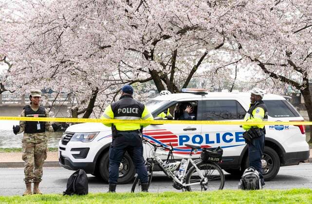 March 24, 2020, Washington, DC, United States: March 24, 2020 - Washington, DC, United States: The Washington DC Tidal Basin Cherry Blossom Trees. Starting Monday, March 23, the Metropolitan Police Department, supplemented by some members of Washington DC National Guard, set up a perimeter around the Tidal Basin to enfore social distancing by keeping people away from the trees so that people would not crowd there while looking at the trees, as they had in previous days. Washington United States - ZUMAb161 20200324_zap_b161_015 Copyright: xMichaelxBrochsteinx