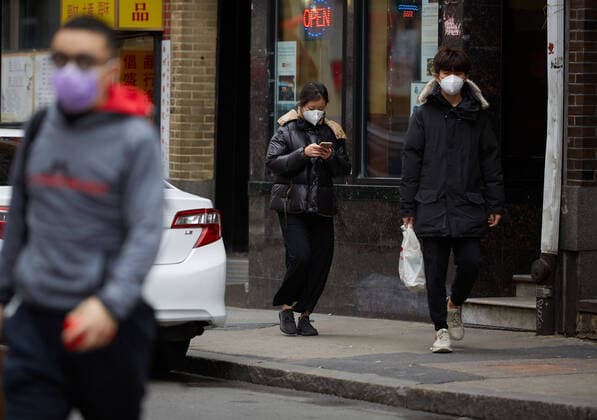 March 24, 2020, Boston, Massachusetts, US: A stay-at-home advisory issued by Governor Charlie Baker and state health officials is now in effect for all Massachusetts residents as of 12 pm on March 24, 2020. This is help hault the spread of the COVID-19, Corona Virus. Boston is quiet, and almost no people are out on the streets. People are seen walking in Chinatown Boston after the stay at home order. Boston US - ZUMAd211 20200324_zap_d211_017 Copyright: xAllisonxDinnerx