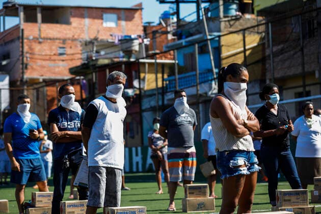 March 24, 2020, Sao Paulo, SP, Brazil: Residents of the PARAISOPOLIS slum in the Sao Paulo city received medical orientations about coronavirus prevention. The initiative organized by the residents association distributed too protection masks, soap and alcohol gel. Sao Paulo Brazil - ZUMAc168 20200324_zap_c168_001 Copyright: xMarceloxChellox