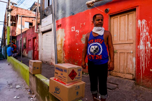 March 24, 2020, Sao Paulo, SP, Brazil: Residents of the PARAISOPOLIS slum in the Sao Paulo city received medical orientations about coronavirus prevention. The initiative organized by the residents association distributed too protection masks, soap and alcohol gel. Sao Paulo Brazil - ZUMAc168 20200324_zap_c168_007 Copyright: xMarceloxChellox