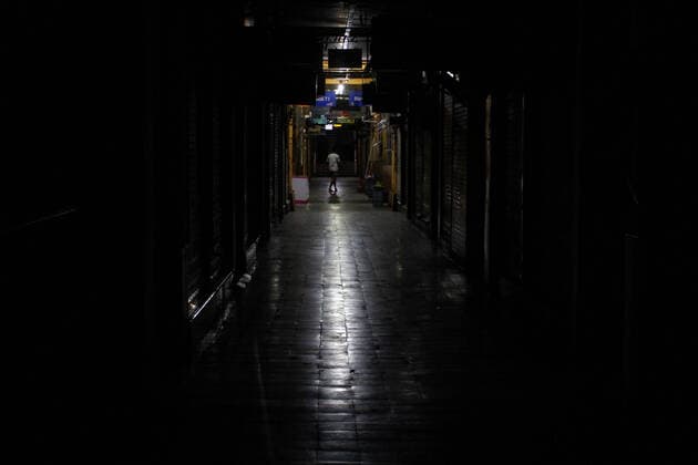 Covid 19 hit tourism in Yogyakarta, Indonesia. Traders cross a lonely alley in the Beringharjo Market, Yogyakarta, Indonesia, March 24, 2020. Since the outbreak of the spread of the corona virus, the market which is an icon of shopping tourism is devoid of thousands of domestic and foreign tourists. (Photo by Devi Rahman INA Photo Agency imago images) 