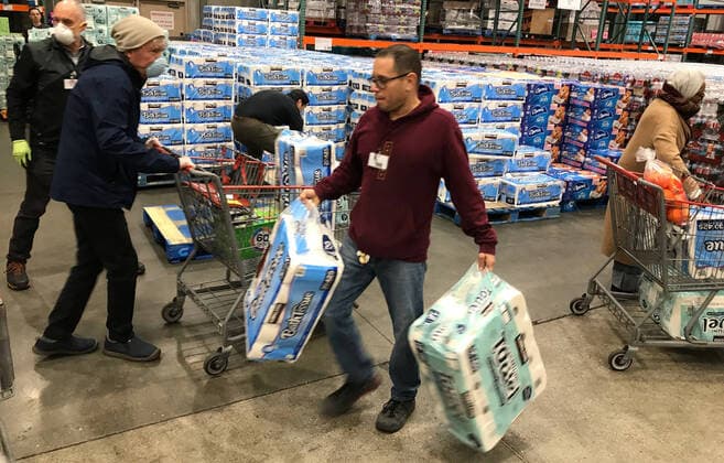 Hundreds of local seniors wait in line as Costco opens up a hour early for them to shop for the first time Tuesday, March 24,2020. Van Nuys CA USA. Costco will be open Tuesdays and Thursday at 8-9am to help the 65 and over people to help them get what they need. Van Nuys USA - ZUMAbl1_ 20200324_zaf_bl1_012 Copyright: xGenexBlevinsx