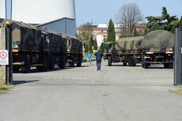 (200324) -- BOLOGNA (ITALY), March 24, 2020 (Xinhua) -- Military trucks carry bodies of patients who died from COVID-19 infections from Bergamo to Bologna, Italy, on March 24, 2020. The COVID-19 pandemic has claimed 6,820 lives in locked-down Italy by Tuesday with the cumulative number of cases reaching 69,176, according to new data released by the Civil Protection Department. (Photo by Gianni Schicchi Xinhua) ITALY-BOLOGNA-COVID-19-DEATH 