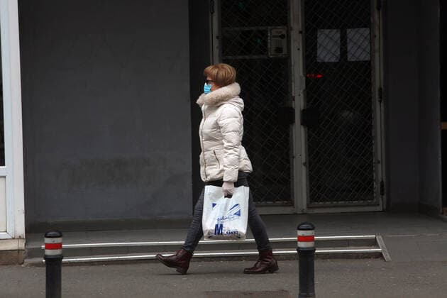 (200325) -- BUCHAREST, March 25, 2020 (Xinhua) -- A woman walks on a street in Bucharest, Romania, March 24, 2020. Romanian President Klaus Iohannis on Tuesday announced a nationwide lockdown from Wednesday morning with only a few exceptions, in a latest move to contain the COVID-19 epidemic. Romania reported 186 more COVID-19 cases on Tuesday, bringing its total to 762. (Photo by Gabriel Petrescu Xinhua) ROMANIA-BUCHAREST-COVID-19-LOCKDOWN 