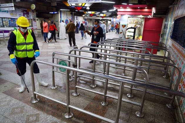 (200325) -- CAIRO, March 25, 2020 -- A man sprays disinfectant in a metro station in Cairo, Egypt on March 24, 2020. Egypt announced on Tuesday that one COVID-19 case died and 36 new cases were detected, bringing the total number of cases in the country to 402. Ahmed Gomaa) EGYPT-CAIRO-METRO-COVID-19-MEASURES WuxHuiwo 