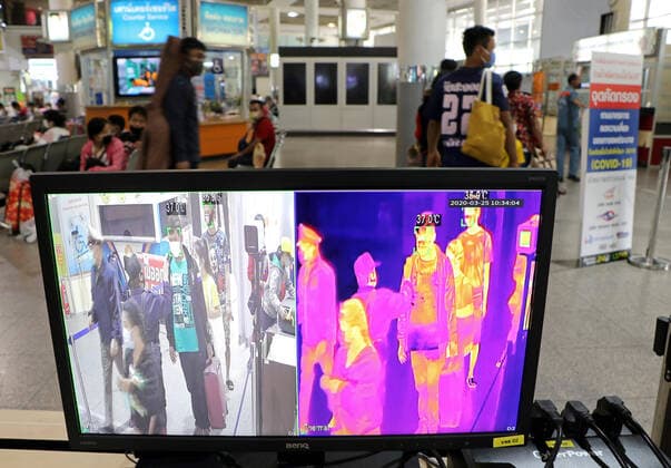 March 25, 2020, Bangkok, Thailand: Passengers walk past a termo scan during the Coronavirus Covid-19 crisis at Bus Terminal in Bangkok on March 25, 2020. The government will declare an emergency and introduce new measures to combat the coronavirus disease 2019 (Covid-19) on Thursday26 March 2020, Prime Minister Prayut Chan-o-cha said. Bangkok Thailand - ZUMAu103 20200325_zia_u103_010 Copyright: xUrdeexImagex
