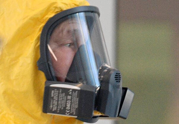 MOSCOW, RUSSIA - MARCH 24, 2020: Russia s President Vladimir Putin wears a protective suit on his visit to the Novomoskovsky multipurpose medical center for patients suspected of the COVID-19 coronavirus infection. Alexei Druzhinin Russian Presidential Press and Information Office TASS  TS0D340E