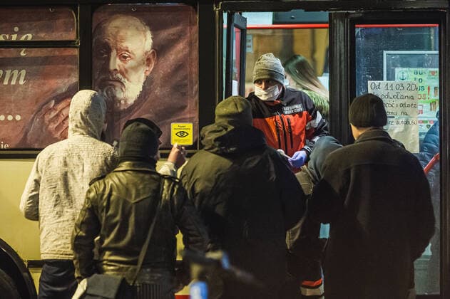 Special SOS Bus in Sopot helps homeless during the coronavirus outbreak Special SOS Bus with a paramedic and some voluntters on the board deliver hot meals and warm clothing to homeless during the coronavirus outbreak on March 24, 2020 in Sopot, Poland. EN_01421673_0008 