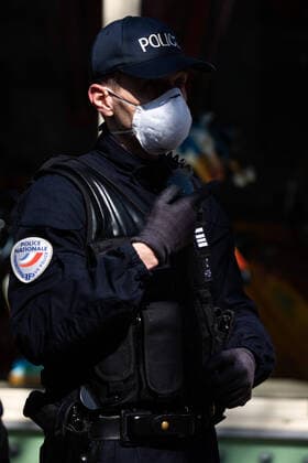 Paris, France, March 19, 2020 - Atmosphere in the streets of Paris after the head of state ordered people to stay home to stop the spread of Covid-19 - Police men wearing masks are conducting checks in the streets of the capital. They can impose a fine if people don t respect the rules of confinement.  Copyright: xAlexisxSciardx