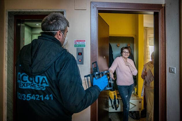 Milan - life in apartment buildings at the time of the Coronavirus. Home water delivery Editorial Usage Only  Copyright: xx xIPAx