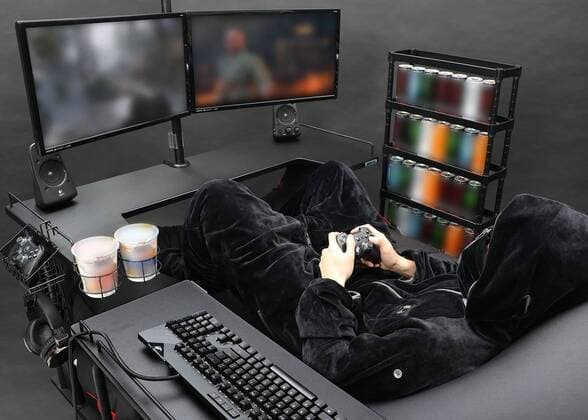 March 25, 2020: A Japanese furniture company have created the perfect coronavirus lockdown set-up with a gaming bed that has room for food and drinks...Video game addicts can now play, eat, drink and nap all without ever leaving their bed...The Ã‚Â£450 gaming bed by Bauhutte means gamers can play non-stop without having to leave for interruptions like eating or sleeping - only the call of nature might lure them away as the bed does not currently feature a bathroom... I wake up and move from my bed to my desk. Why is that so complicated? gaming furniture outfit Bauhutte says in promotions for the bed on its website... Gaming beds solve this problem. ..The bed comes with a desk that can support video screens, an elevating headboard and a headphone hanger...A metallic arm attached to the bed can mount a tablet screen above a person s fa - ZUMAc218 20200325_zia_c218_013 Copyright: xCOVERxImagesx