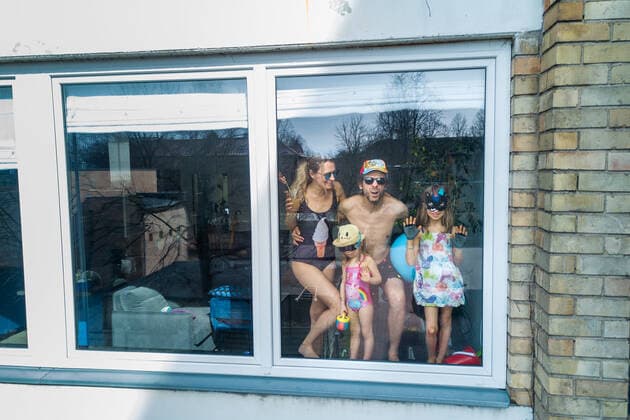 March 24, 2020, Vilnius, Lithuania: ALL PHOTOS WERE TAKEN WITH CONSENT AND WITH PERMISSION TO SHARE IMAGES**..A photographer has used his drone to capture images of people quarantined in their homes during the coronavirus pandemic...The heartwarming photos show how Lithuanian families are spending their time in lockdown, away from the outside world...Photographer Adas Vasiliauskas explained how due the cancellation of his usual advertising photography jobs he decided to make the most of social distancing and show how people are brought together in a time of isolation...Adas explains: At first I thought of offering to shoot people with a telephoto lens, but then I remembered I use a drone in my wedding photography and the drone is a totally zero-human-contact way to capture things. .. I shot a few of my friends, the photos gained a lot - ZUMAc218 20200324_zia_c218_044 Copyright: xCOVERxImagesx