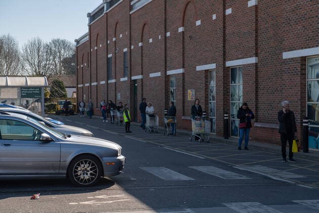 Shoppers queuing outside Morrisons in Sidcup, Kent during the Coronavirus (COVID-19) outbreak where travel has been restricted across the country at Sidcup, England on 25 March 2020. Copyright: xAlanxStanfordx PMI-3450-0006
