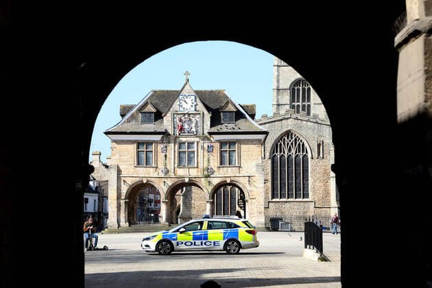 Day Two of Lockdown in Peterborough. Police patrol Cathedral Square in Peterborough. The country is on lockdown due to the COVID-19 Coronavirus pandemic. People are not allowed to leave home except for minimal food shopping, medical treatment, exercise - once a day, and essential work. COVID-19 Coronavirus lockdown, Peterborough, Cambridgeshire, UK, on March 25, 2020 