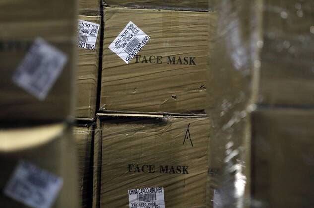 Workers sort out all the personal protective equipment (PPE) received from China at a warehouse in Valencia, Spain, 25 March 2020. A total of 3,800,000 masks, 5,000 protective suits and 2,000,000 gloves arrived to Valencia region to equip hospitals and elder homes in the need of this material amid the coronavirus outbreak. Spain is on its 11th consecutive day of national lockdown imposed by the government in an attempt to slow down the spread of the pandemic COVID-19 disease caused by the SARS-CoV-2 coronavirus. Protection material arrives to Spain from China !ACHTUNG: NUR REDAKTIONELLE NUTZUNG!  Copyright: xJuanxCarlosxCárdenasx GRAFCVA3416 20200325-637207248930790200