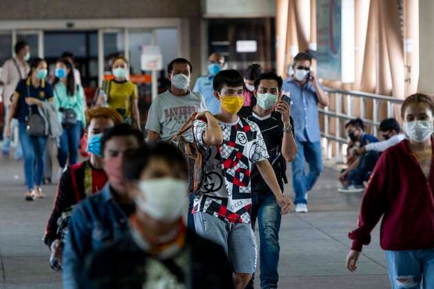 March 25, 2020, Bangkok, Bangkok, Thailand: Prime Minister Prayut Chan-O-Cha declared that starting at midnight March 26, 2020 Thailand would institute the most comprehensive lockdown procedures so far to combat the spread of Covid-19. For the third day in a row crowds of passengers gathered at Bangkok s Mochit Bus Terminal to leave the city, many making the decision to leave the Thai capital due to the mass closure of businesses causing financial burden on the city s economically insecure workforce. Bangkok Thailand - ZUMAt128 20200325_zap_t128_003 Copyright: xAdryelxTalamantesx