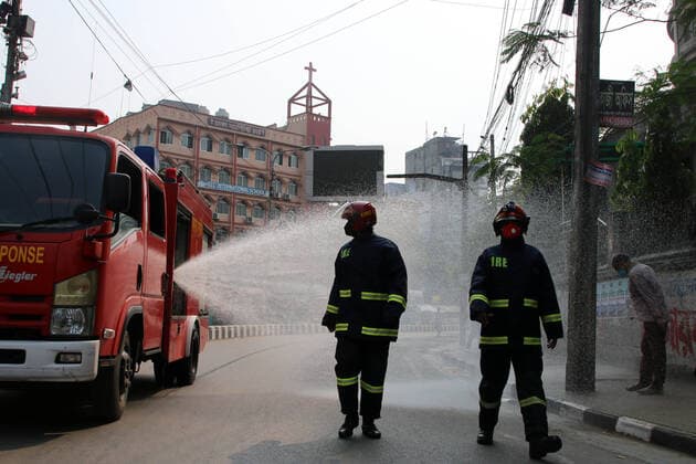 March 26, 2020, Dhaka, Bangladesh: A fire bridge tanker truck sprays disinfectant along a street as a preventative measure against the spread of the COVID-19 coronavirus, in Dhaka..Death toll raised to 5 and 39 people were reported infected by COVID-19 in Bangladesh. Dhaka Bangladesh - ZUMAs197 20200326_zaa_s197_012 Copyright: xSultanxMahmudxMukutx
