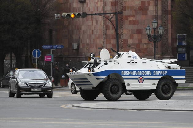 YEREVAN, ARMENIA - MARCH 25, 2020: An armoured police vehicle in a street during the pandemic of the novel coronavirus (COVID-19). As of 25 March 2020, Armenia has confirmed more than 250 cases of the novel coronavirus. The Armenian government declared a state of emergency and enforced restricted movement in connection with the pandemic on 16 March. Hayk Baghdasaryan Photolure TASS  TS0D354C