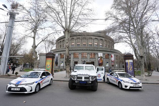 YEREVAN, ARMENIA - MARCH 25, 2020: Police vehicles parked near the Armenian National Academic Theatre of Opera and Ballet during the pandemic of the novel coronavirus (COVID-19). As of 25 March 2020, Armenia has confirmed more than 250 cases of the novel coronavirus. The Armenian government declared a state of emergency and enforced restricted movement in connection with the pandemic on 16 March. Vahram Baghdasaryan Photolure TASS  TS0D354F