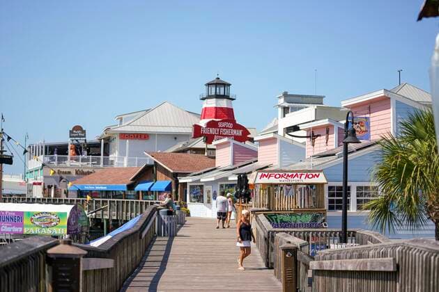 March 25, 2020, Madeira Beach, Florida, USA: A handful of people visit the boardwalk at John s Pass, where only a few businesses remain open due to the coronavirus pandemic, on Wednesday, March 25, 2020 in Madeira Beach. Madeira Beach USA - ZUMAs70_ 20200325_zan_s70_089 Copyright: xMarthaxAsencioxRhinex