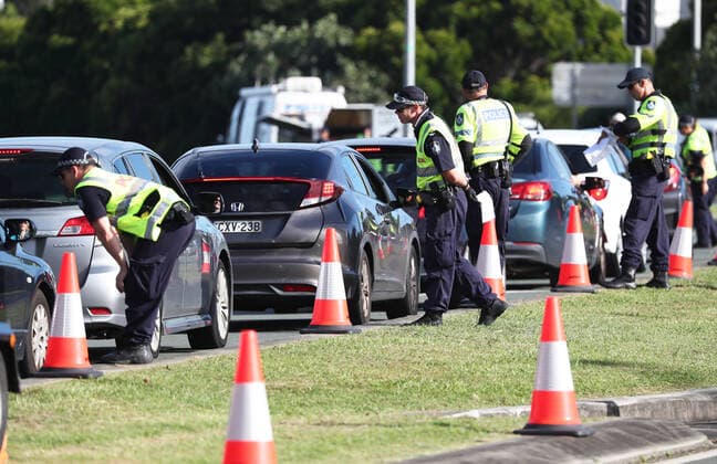 QLD BORDER CLOSURE, A Police checkpoint is seen on The Gold Coast Highway in New South Wales near the Queensland Border, Thursday, March 26, 2020. The Queensland border closed at midnight on Wednesday as authorities try to stop the spread of COVID-19. ( NO ARCHIVING, EDITORIAL USE ONLY, NO USE IN BOOKS WITHOUT CONSENT BRISBANE QLD AUSTRALIA  Copyright: xJASONxO BRIENx 20200326001459847261
