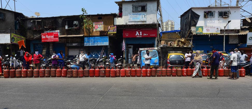 MUMBAI, INDIA - MARCH 25: Mumbaikar stand in que for Gas Cylinder at Barkat ali naka Antop Hill during restrictions on citizens movement on account of section 144 due to COVID 19 Pandemic, on March 25, 2020 in Mumbai, India. Prime Minister Narendra Modi on Tuesday announced complete lockdown of the entire country, as part of the government?s stringent efforts to tackle coronavirus disease Covid-19. This lockdown will be in place for 21 days and more stringent than Janta Curfew. Although, ration shops, groceries, fruits and vegetable shops, dairy and milk booths, meat and fish shops, animal fodder will remain open during the 21-day lockdown. (Photo by Vijayanand Gupta Hindustan Times ) India Goes Into 21 Day Lockdown Due To Coronavirus COVID 19