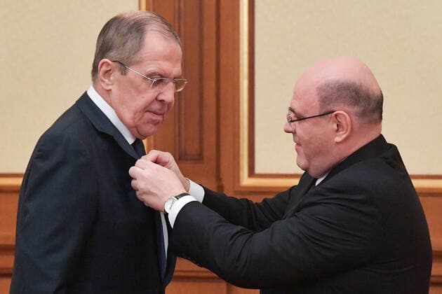 MOSCOW, RUSSIA - MARCH 26, 2020: Russia s Prime Minister Mikhail Mishustin (R) awards Russia s Foreign Minister Sergei Lavrov with the Stolypin Medal during a meeting of the Russian Government at the Russian Government House. Alexander Astafyev POOL TASS  TS0D3634