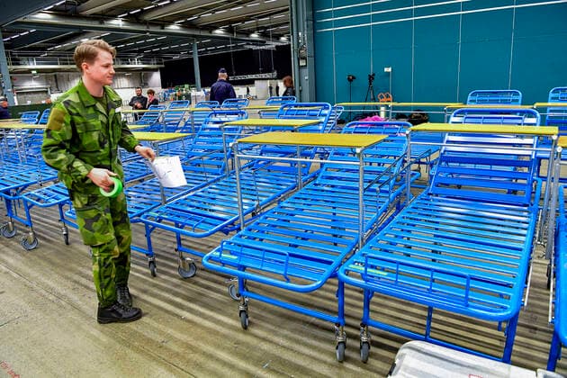 The Swedish Armed Forces are building a field hospital inside the exhibition center Stockholmsmässan in Älvsjö in southern Stockholm, Sweden on March 26, 2020 The field hospital will provide extra intensive care space for COVID 19 patients should it be necessary STOCKHOLM SWEDEN x10030x,  Copyright: xJonasxEkstromer TTx FIELD HOSPITAL SWEDEN