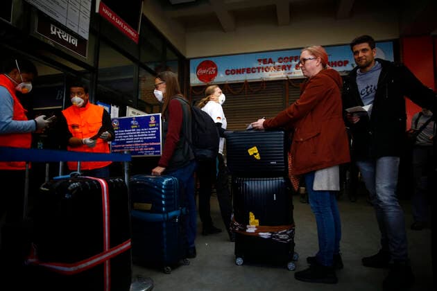 March 27, 2020, Kathmandu, Nepal: Tourists from Germany whom were stranded due to the lockdown imposed by the government amid concerns on the spread of coronavirus wait for their chartered flight back to Germany at Tribhuvan International Airport in Kathmandu, Nepal on Friday, March 27, 2020. Kathmandu Nepal - ZUMAg200 20200327_zap_g200_004 Copyright: xSkandaxGautamx