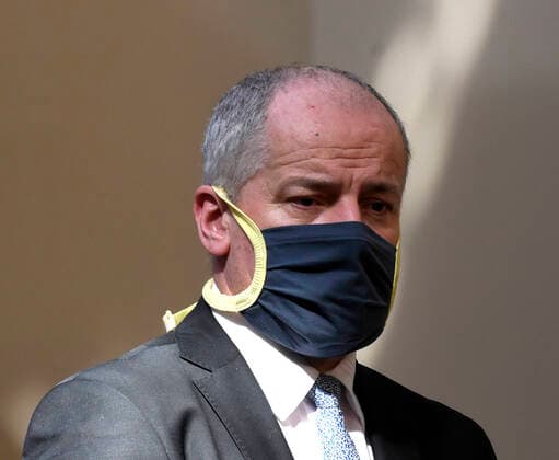 Deputy Health Minister and Central Crisis Staff head Roman Prymula with a protection face mask attends a press conference after extraordinary government meeting related to spread of novel coronavirus, on March 26, 2020, in Prague, Czech Republic. (CTKxPhoto MichalxKrumphanzl) CTKPhotoP202003260592401 kru 8