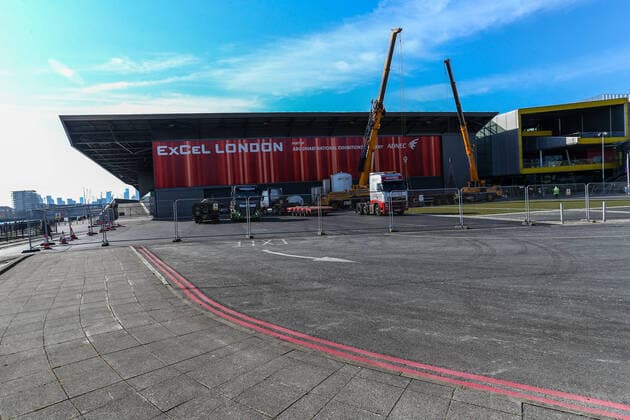 Equipment is seen outside the ExCell Center in London, Thursday, March 26, 2020. The British Government announced Tuesday, that the ExCel Center in east London will become a 4,000-bed temporary hospital to deal with future coronavirus patients. It will be called NHS Nightingale Hospital. (Photo Vudi Xhymshiti) 