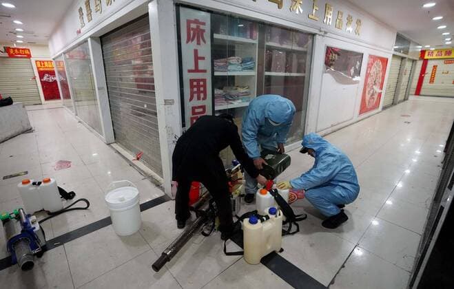 (200327) -- WUHAN, March 27, 2020 -- Staff members prepare to disinfect a shopping mall at the Hanzheng Street in Wuhan, central China s Hubei Province, March 27, 2020. The shopping mall was thoroughly cleaned and disinfected before resumption of business. ) CHINA-HUBEI-WUHAN-SHOPPING MALL-DISINFECTION (CN) WangxYuguo 