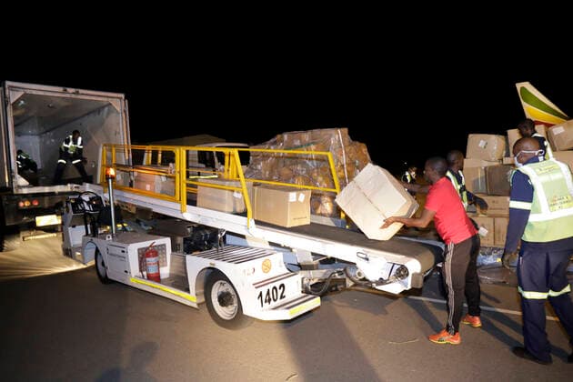 (200327) -- GABORONE, March 27, 2020 (Xinhua) -- Supplies donated by Jack Ma Foundation and Alibaba Foundation are loaded on a truck at Sir Seretse Khama International Airport in Gaborone, Botswana, March 27, 2020. The Jack Ma Foundation and Alibaba Foundation donated a consignment of laboratory diagnostic test kits to Botswana to help fight the COVID-19 pandemic. (Photo by Tshekiso Tebalo Xinhua) BOTSWANA-GABORONE-COVID-19-CHINA-DONATION 